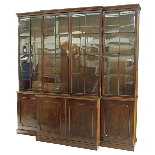 785 - Good large 19th century mahogany breakfront library bookcase, the upper sections with four glazed do... 