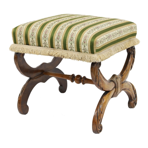 793 - Victorian walnut carved X-frame stool, with a green and pale striped stuffover seat upon an acanthus... 