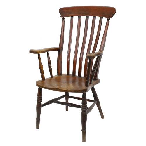 796 - 19th century elm seat Windsor armchair, the slat back over a solid seat and upon turned supports uni... 