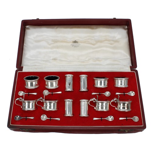 507 - Asprey & Co. silver cased condiment set, consisting of four blue glass lined salts, four peppere... 