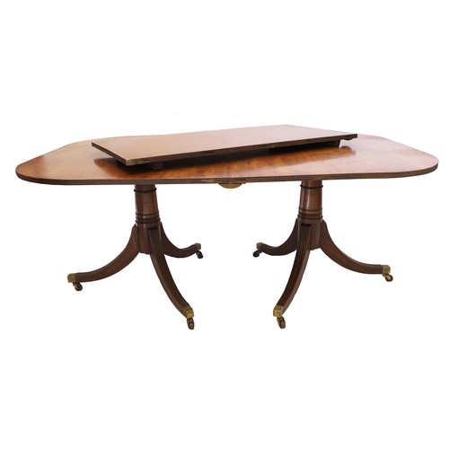 820 - Georgian style twin-pedestal extending dining table, with D-ends with reeded borders upon turned sup... 