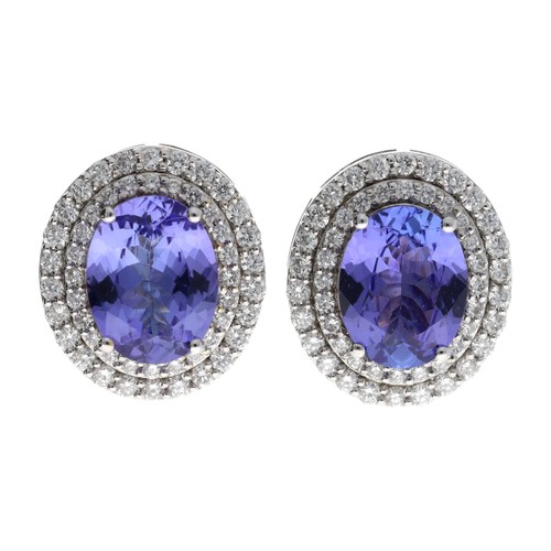 45 - Attractive pair of 18ct white gold tanzanite and diamond oval cluster earrings, each with an oval ta... 