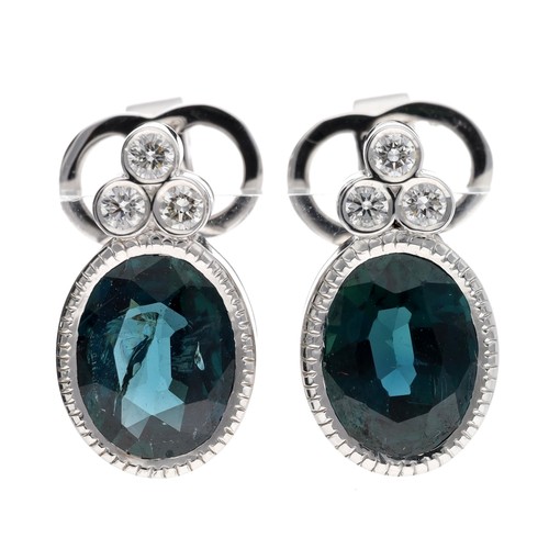 115 - Pair of modern 18ct white gold green sapphire and diamond earrings, each with three round brilliant-... 