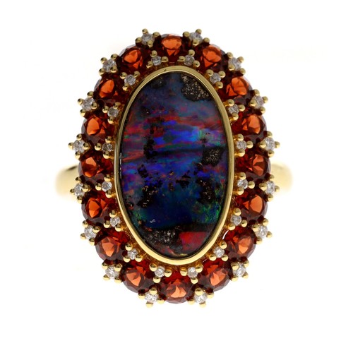 145 - 18ct boulder opal, diamond and gem set oval dress ring,  the opal 3.50ct, round brilliant-cuts 2.37c... 