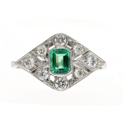 82 - Art Deco style platinum emerald and diamond cluster ring, the emerald 0.40ct approx, round brilliant... 