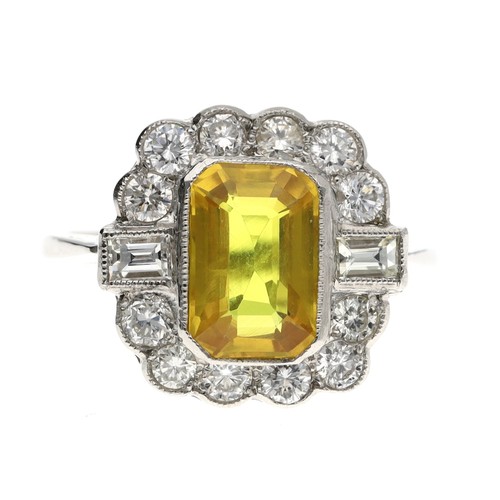 102 - Attractive platinum yellow sapphire and diamond cluster ring, the sapphire 2.20ct approx, with bague... 