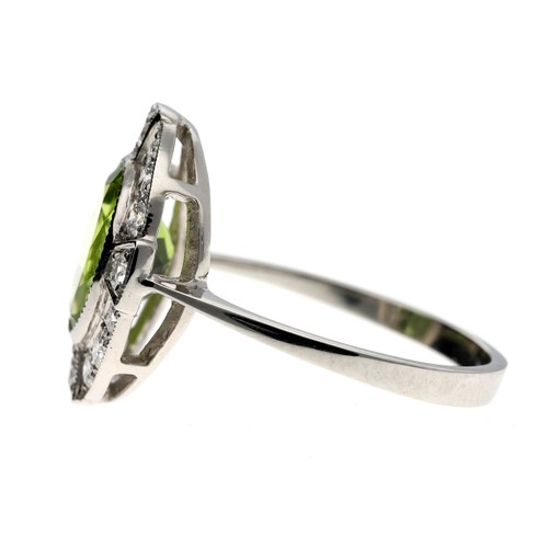 142 - Platinum peridot and diamond oval cluster ring, the peridot 1.70ct approx, round brilliant-cut diamo... 