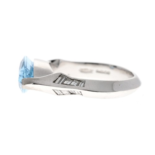 216 - Unusual platinum marquise shaped aquamarine and diamond ring, the slender shoulders set with baguett... 