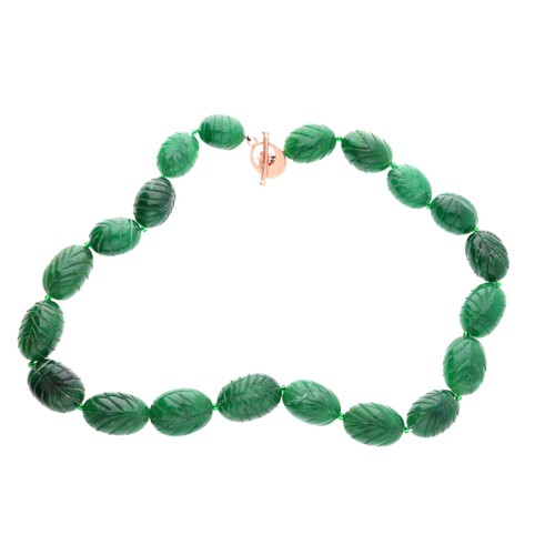 54 - Large and heavy carved reconstituted emerald bead necklace with a rose coloured toggle clasp, the be... 