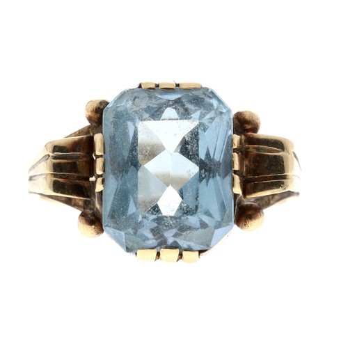 109 - 14ct yellow gold topaz single stone set ring with a stylised setting, width 12mm, 3.1gm, ring size K... 