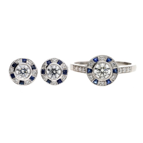 73 - Attractive platinum sapphire and diamond cluster ring, round brilliant-cut diamonds and calibrated s... 