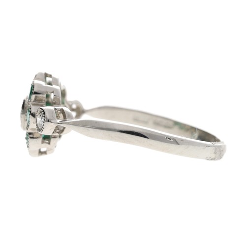 83 - Attractive platinum emerald and diamond cluster ring, the emeralds 0.40ct approx in total, round bri... 