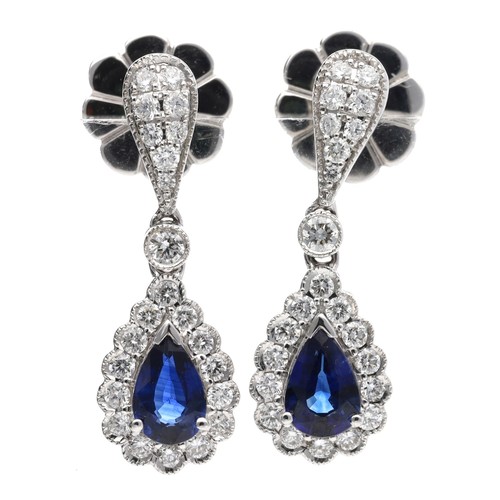 113 - Attractive pair of 18ct white gold pear shaped sapphire and diamond drop earrings, the sapphires eac... 