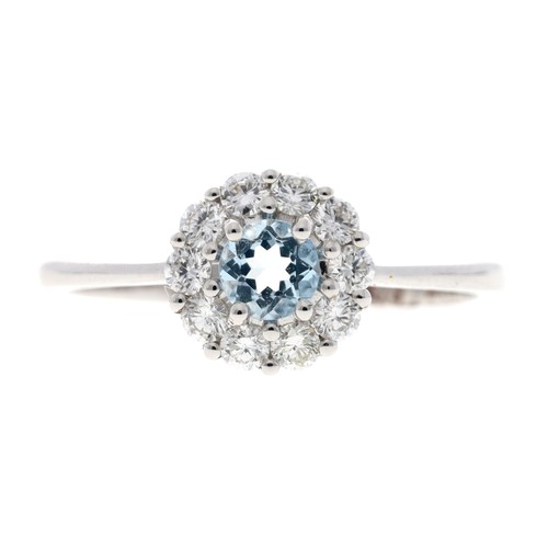 133 - Attractive 18ct white gold aquamarine and diamond circular cluster ring, the aquamarine 0.25ct appro... 