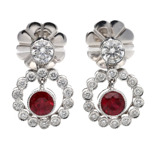 163 - Attractive pair of 18ct white gold ruby and diamond earrings, with suspended rubies in a diamond set... 