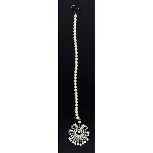 118 - Attractive diamond set tiara/hair attachment on a short cultured pearl suspension, set with baguette... 