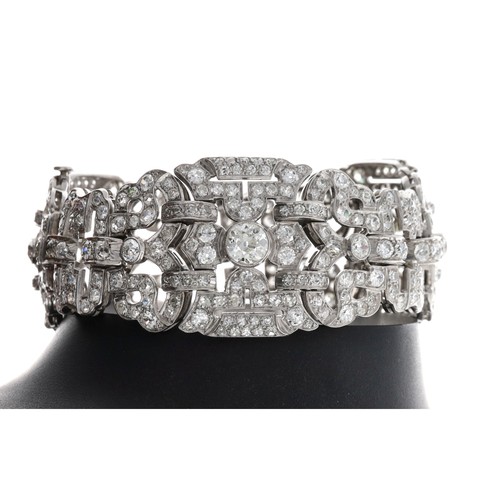 234 - Fine and impressive Art Deo platinum diamond set bracelet, composed of three three large oval pierce... 