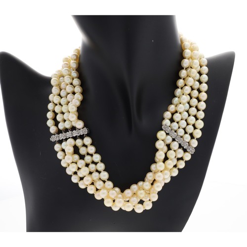 34 - Good cultured pearl five strand necklace, with white gold spacer mounts set with diamonds, each row ... 