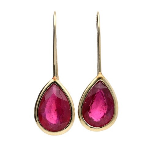 90 - Pair of pear shaped ruby earrings set on yellow metal, each 3.20ct approx, stamped '10k', hook backs... 