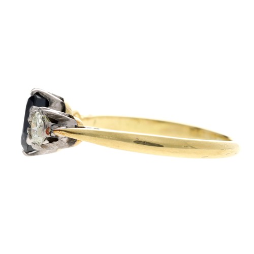 107 - 18ct yellow gold sapphire and diamond three stone ring, the centred oval sapphire 0.75ct approx, wit... 