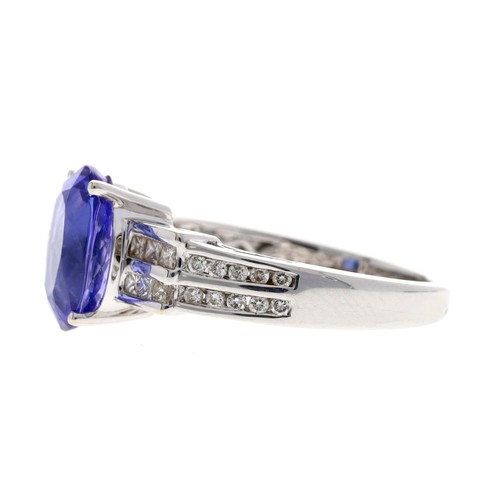 111 - Fine modern 18ct white gold tanzanite and diamond ring by Illiana, the tanzanite of good colour 4.00... 