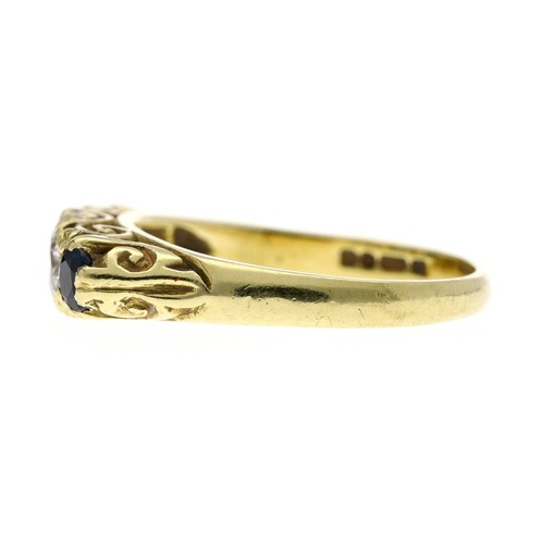 136 - Attractive 18ct yellow gold sapphire and diamond five stone ring in a scroll setting, with three rou... 