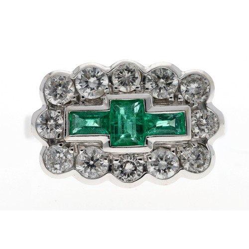 137 - Good fancy modern 18ct white gold emerald and diamond dress cluster ring, with tree emeralds in a bo... 