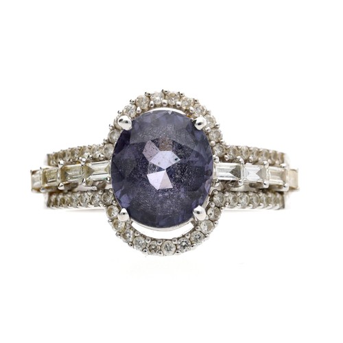 193 - Modern 18ct white gold spinel and diamond ring, the oval spinel 3.39ct approx, round brilliant-cut d... 