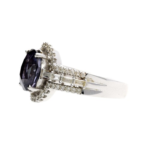 193 - Modern 18ct white gold spinel and diamond ring, the oval spinel 3.39ct approx, round brilliant-cut d... 