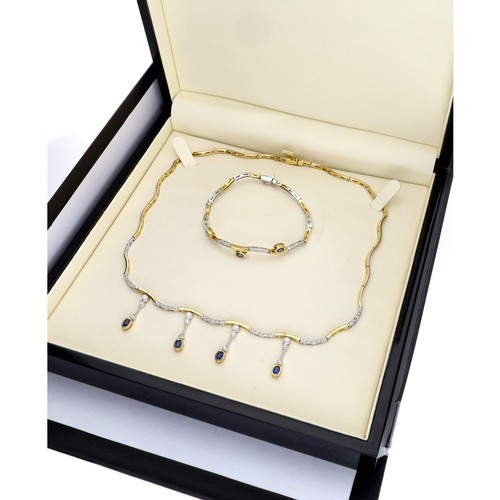 211 - Attractive modern 18ct bicolour sapphire and diamond necklet and matching bracelet, the wave set nec... 