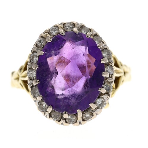 222 - 18ct yellow gold oval amethyst and diamond cluster ring with pierced stylised shoulder, 16mm x 13mm,... 