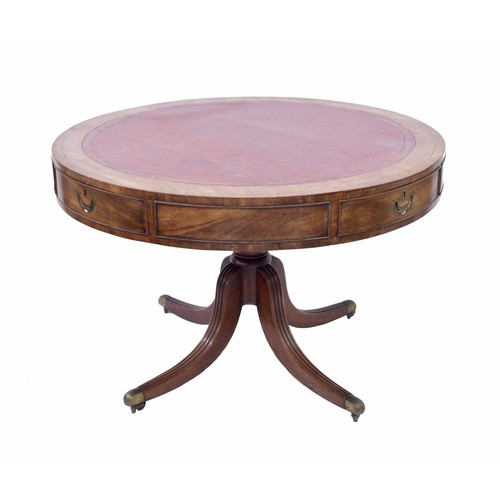 784 - Georgian mahogany library drum table, the top having an inset red leather surface with tooled border... 