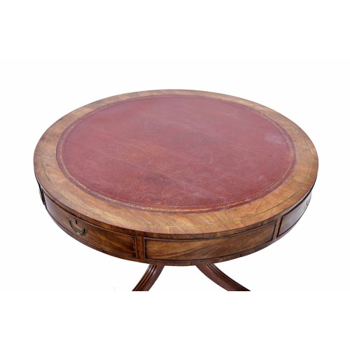 784 - Georgian mahogany library drum table, the top having an inset red leather surface with tooled border... 