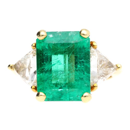 293 - Fine 18ct yellow gold emerald ring with trilliant-cut diamond shoulders, the emerald 12mm x 9mm, the... 