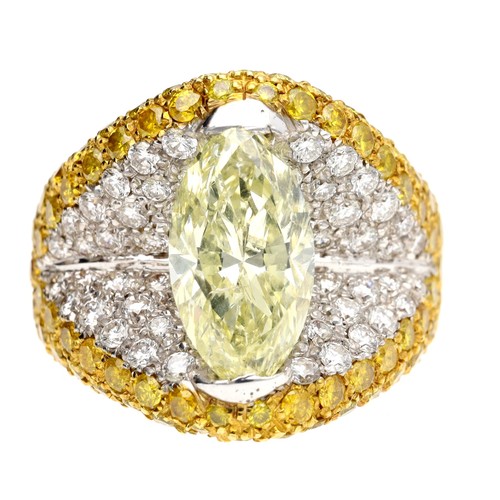 294 - Attractive fancy yellow marquise diamond dress ring, in a pavé setting of round brilliant and yellow... 