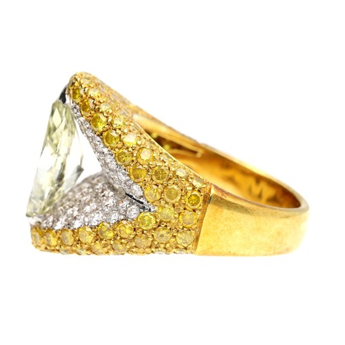 294 - Attractive fancy yellow marquise diamond dress ring, in a pavé setting of round brilliant and yellow... 