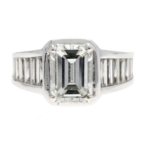 321 - Fine white metal emerald-cut diamond ring with full set diamond band, the emerald-cut diamond 9.5mm ... 