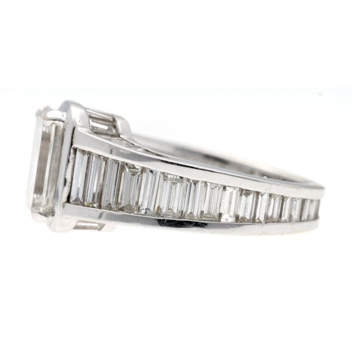 321 - Fine white metal emerald-cut diamond ring with full set diamond band, the emerald-cut diamond 9.5mm ... 