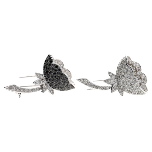 323 - Pair of 18ct white gold pavé diamond set flower brooches, one with black diamonds,  stamped 750, 20g... 