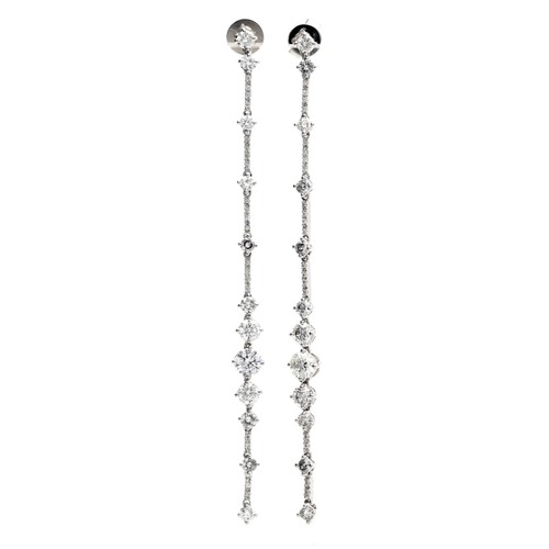 266 - Pair of modern 18ct white gold long diamond drop earrings, round brilliant-cut diamonds, the largest... 