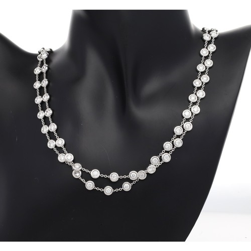 306 - 18ct white gold brilliant-cut diamond set necklace, set with eighty-one stones, estimated 15.00-16.0... 