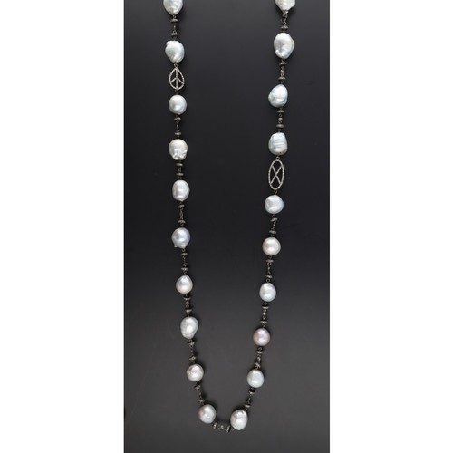 280 - Attractive baroque pearl and diamond set necklace, 103.3gm, 35