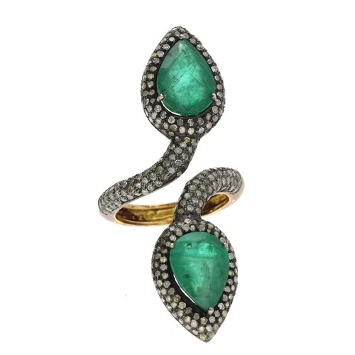 289 - Emerald and diamond upfinger serpent design ring, with two pear-cut emeralds each 12.5mm x 9mm, in a... 