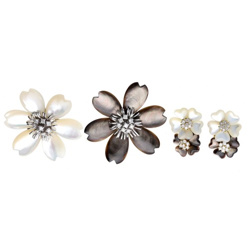 318 - Two similar mother of pearl and diamond 18ct mounted flower pendants/brooches , each 0.43ct in total... 