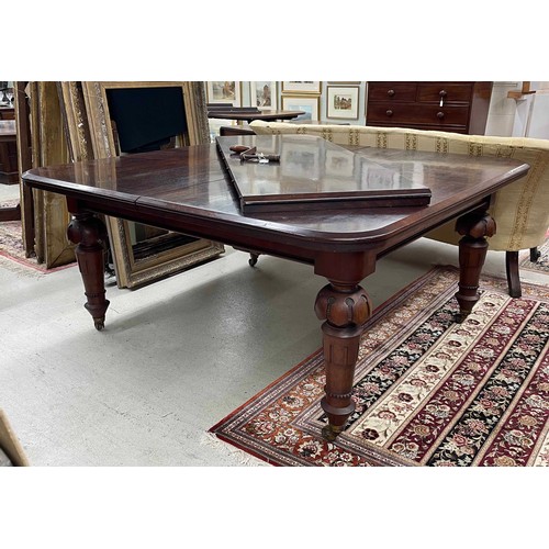 806 - Impressive large Victorian mahogany extending dining room table, with four bold carved and beaded le... 