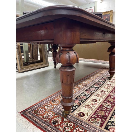 806 - Impressive large Victorian mahogany extending dining room table, with four bold carved and beaded le... 