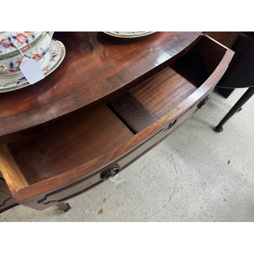 1800F - Georgian style mahogany sideboard, with a crossbanded top and central tambour compartment, 60”... 