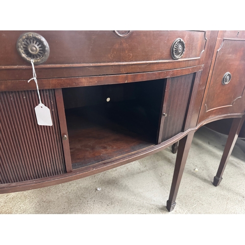 1800F - Georgian style mahogany sideboard, with a crossbanded top and central tambour compartment, 60”... 