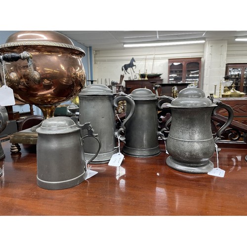 1199 - Four 18th/19th dome top lidded pewter tankards, the tallest 8.5