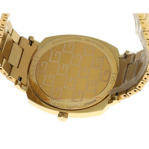 714 - Gucci Grip Jump Hour gold plated gentleman's wristwatch, reference no. 157.3, the case with hour min... 